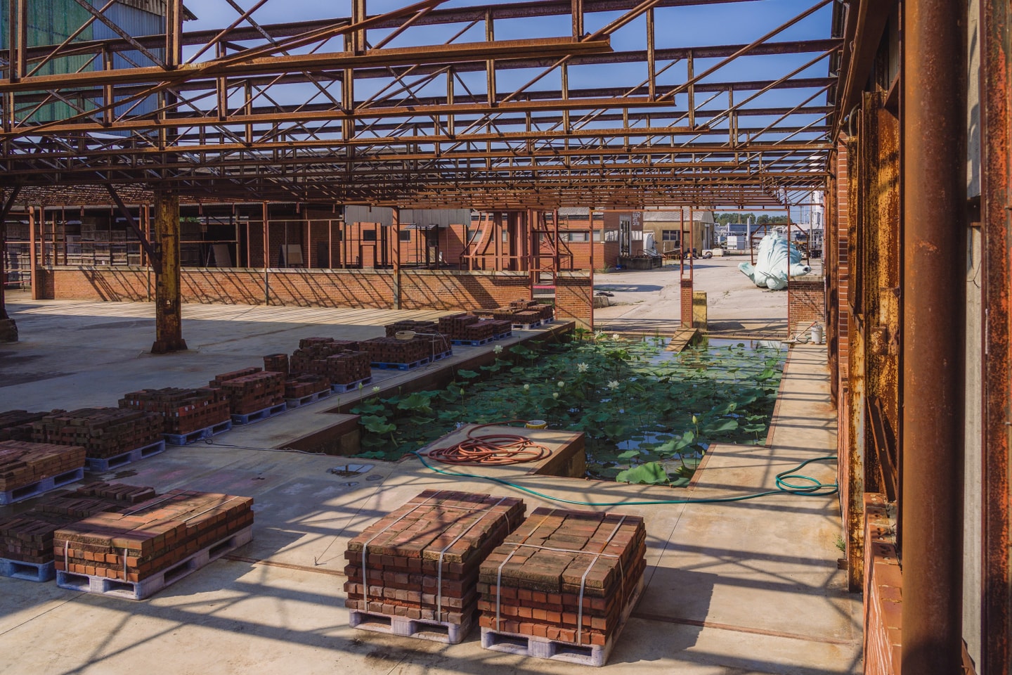 a large unloading dock with a pond