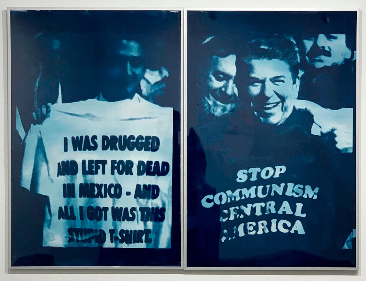Two cyanotype prints of two men holding up T-shirts with text on them