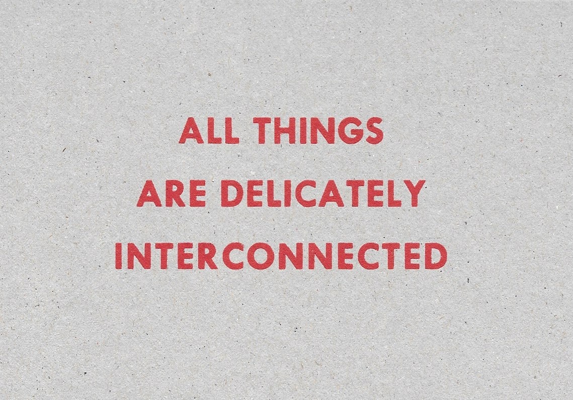 All Things are Delicately Interconnected [Red Text on Cardboard]