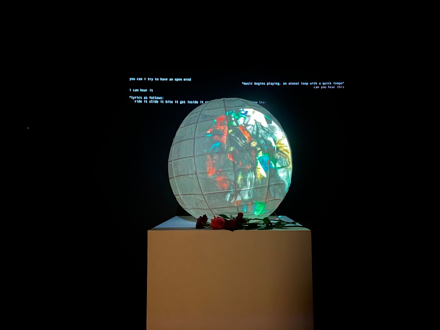 A closeup of the orb with the text behind it. 