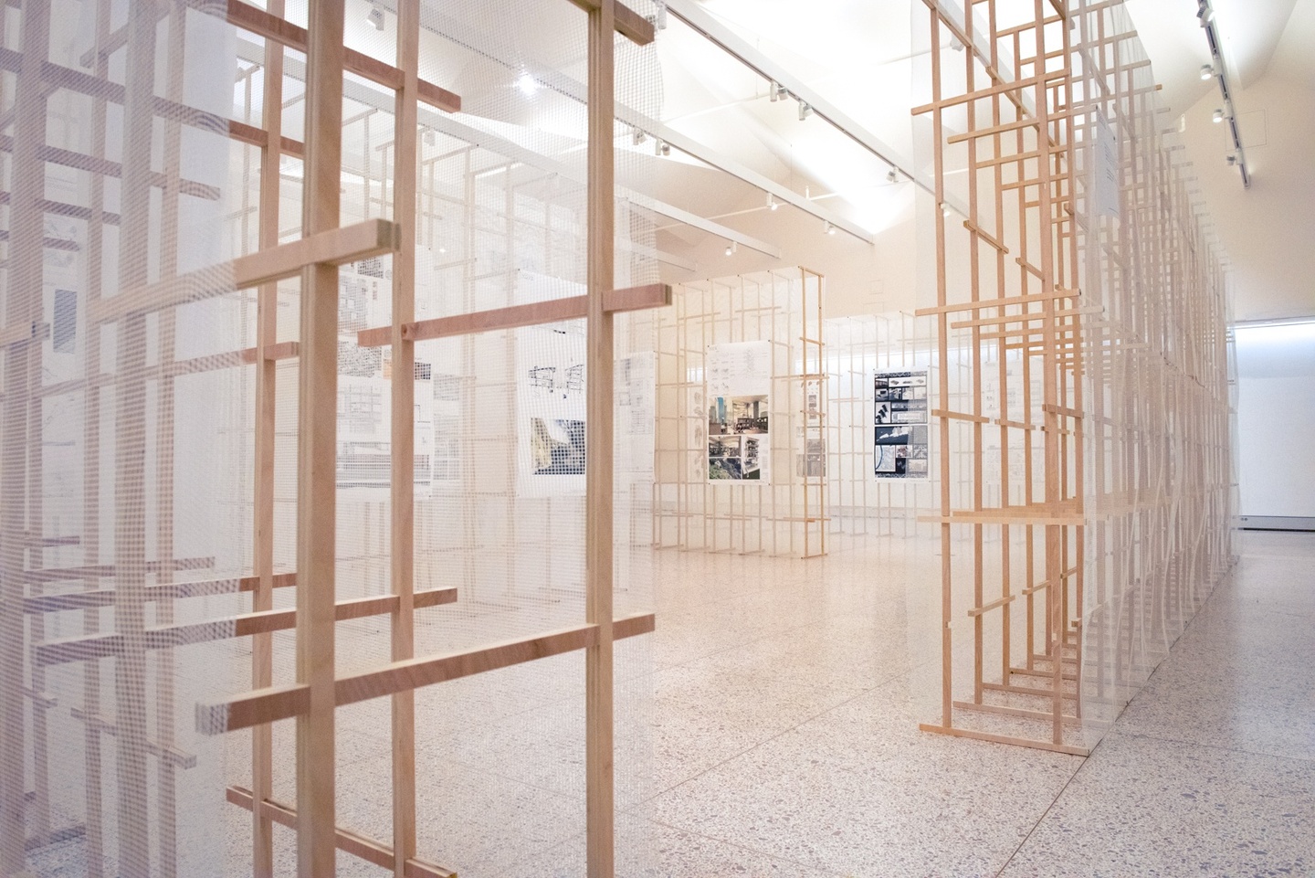 Wooden frameworks built to display prints of architecture student work.