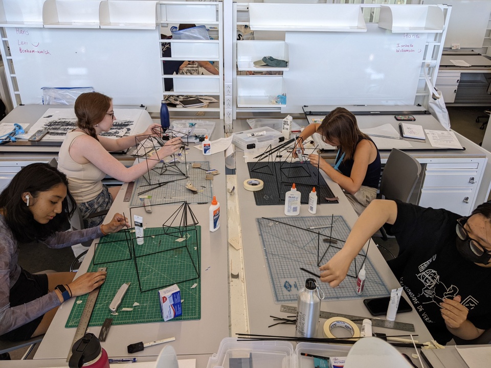 Students building models in a studio