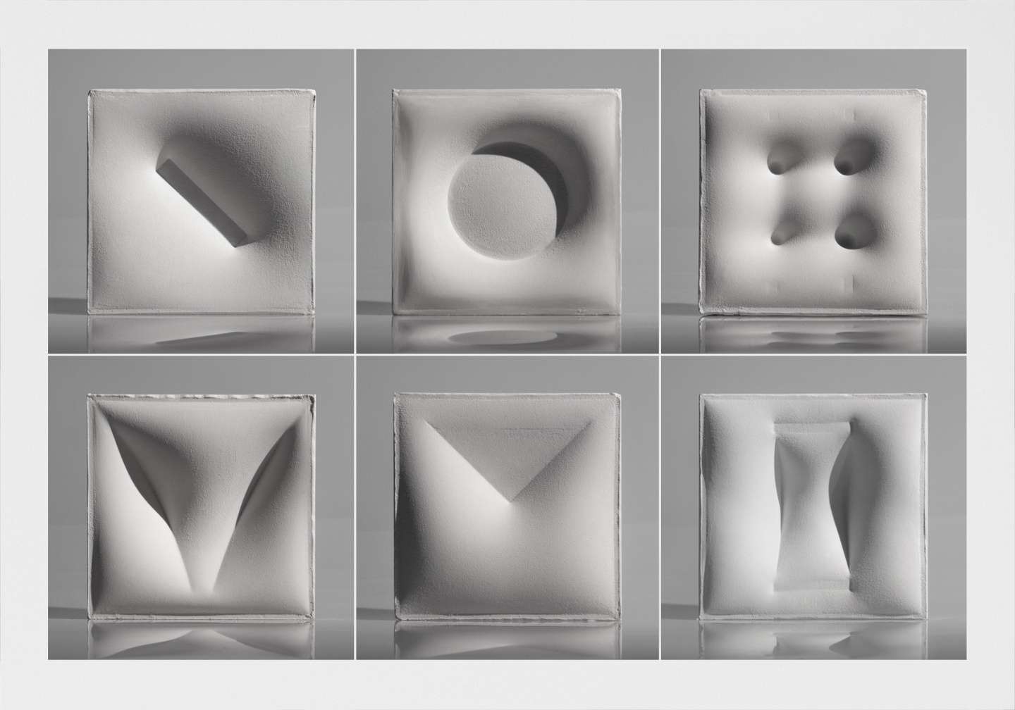 Six squares of cast plaster that have been made as reverse impressions of the frames from the previous image.