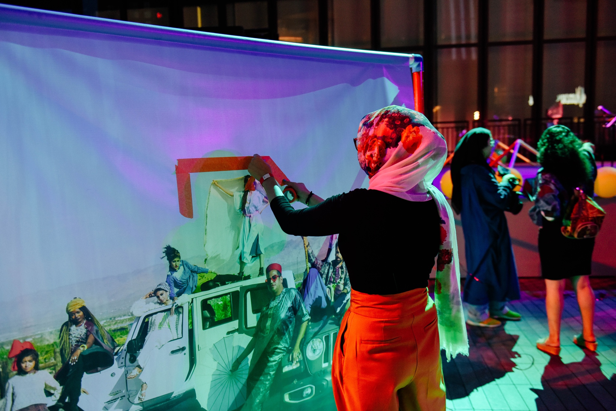 An audience member interacting with an installation artwork by MIPSTERZ.