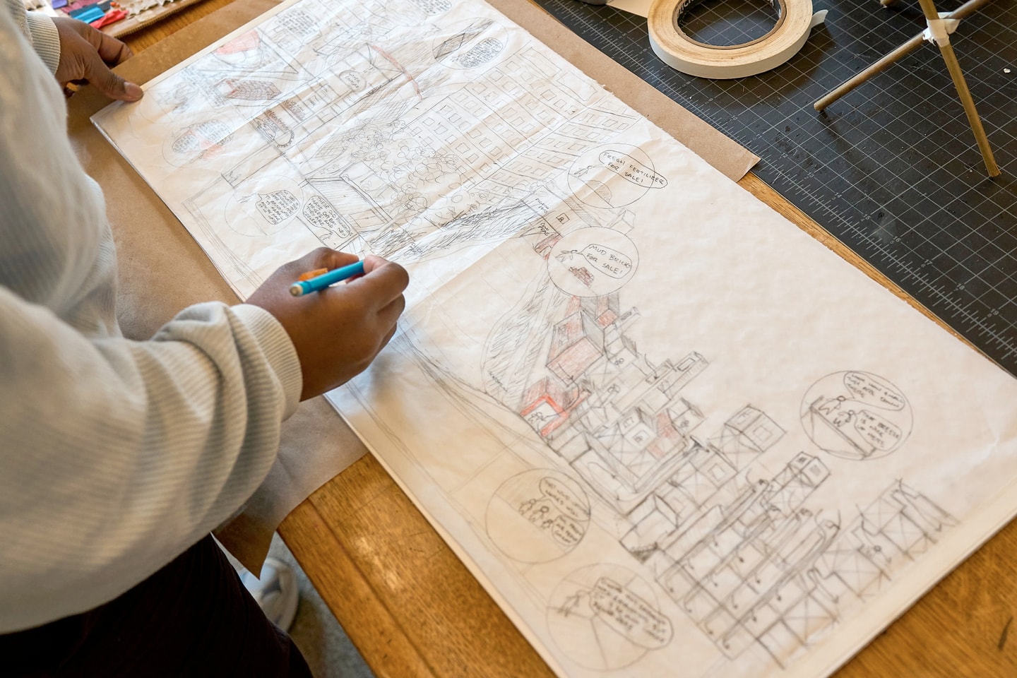 person working on design sketches