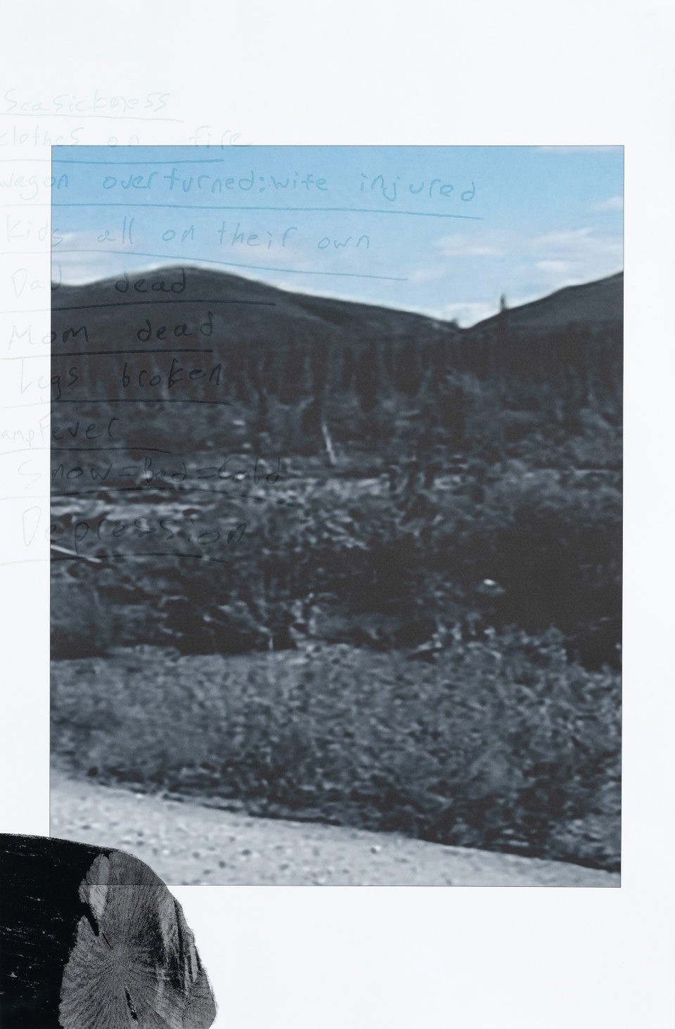 image of a road in the landscape with large black shape in lower left corner