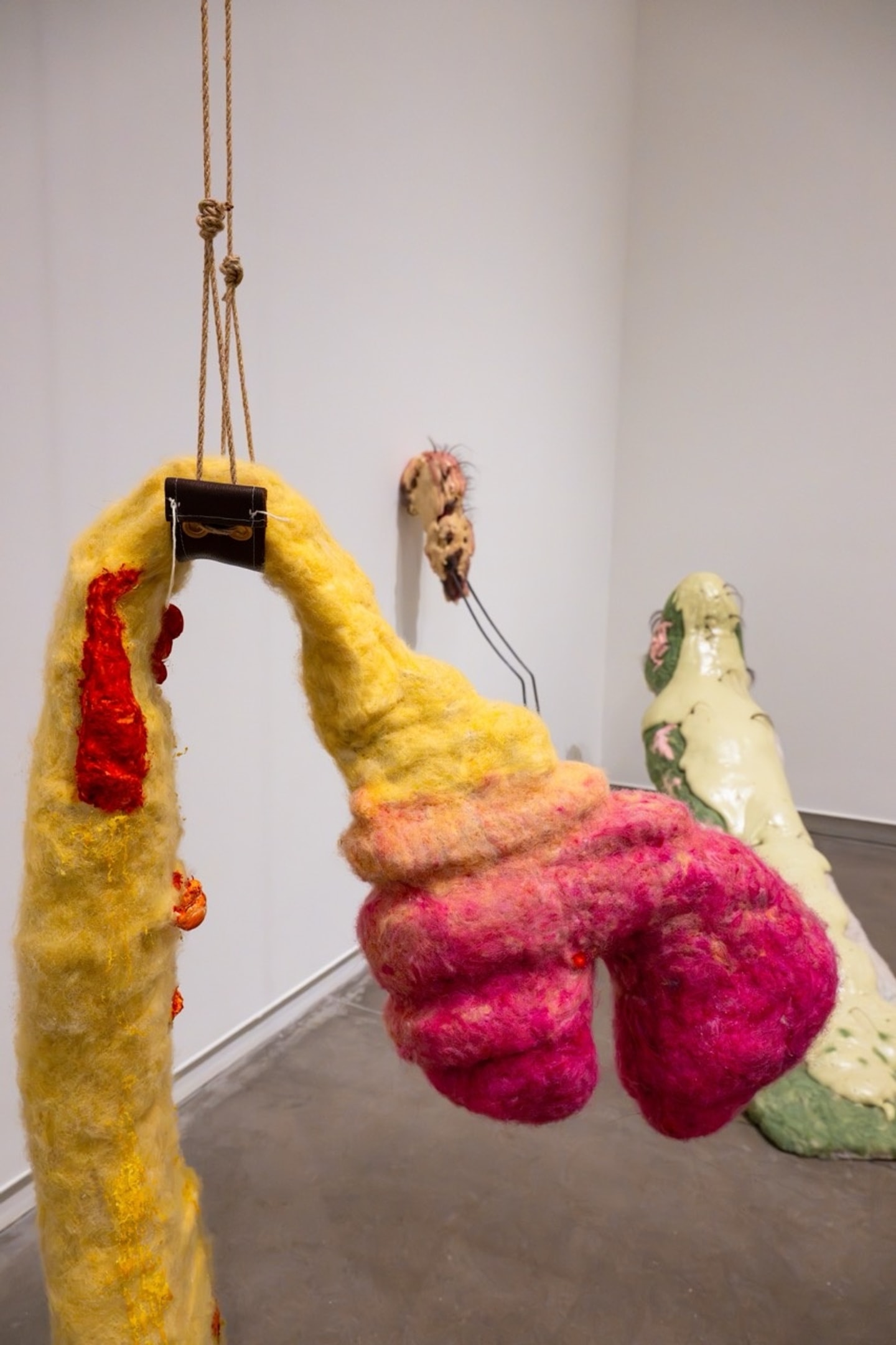 life size felted figures in a variety of colors