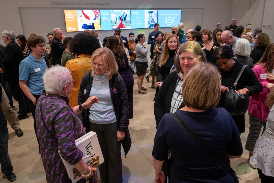 Crowd in a museum lobby.