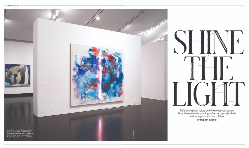 An image of a two-page spread of an Art in America review showing an abstract painting by Mary Weatherford with a neon light and the words "Shine the Light".