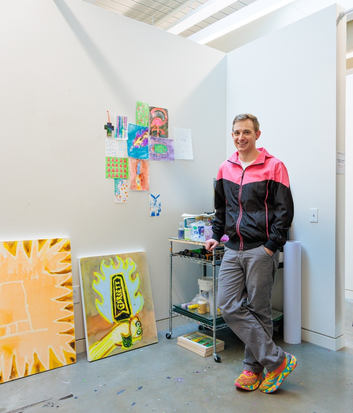 Artist Roy Uptain standing in studio