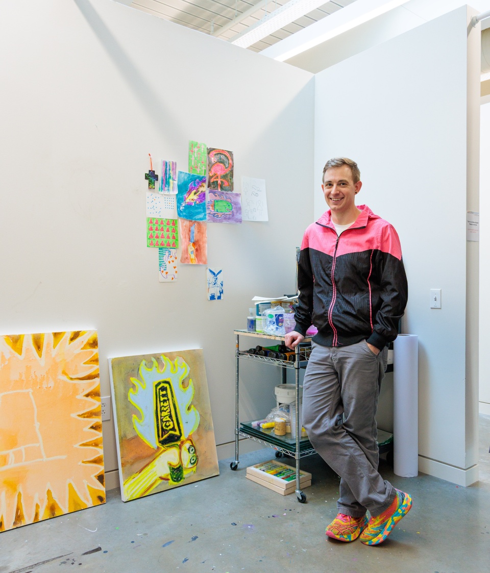 Artist Roy Uptain standing in studio