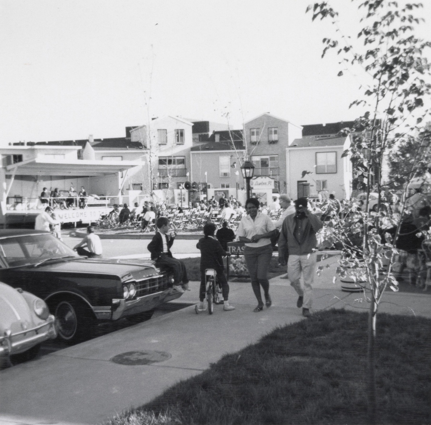 black and white photo of people gathered at a festival