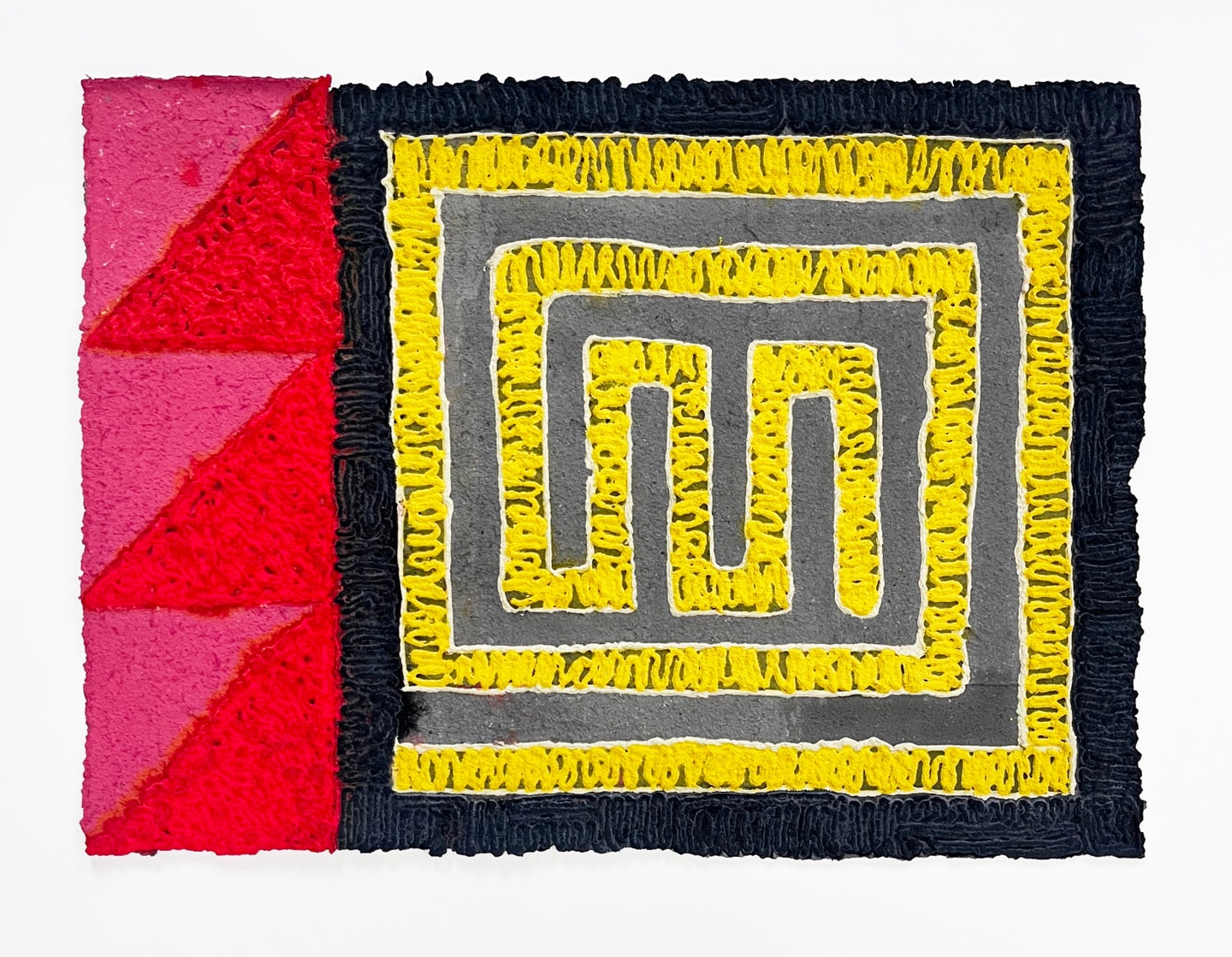 geometric patterns in yellow, black, red and pink