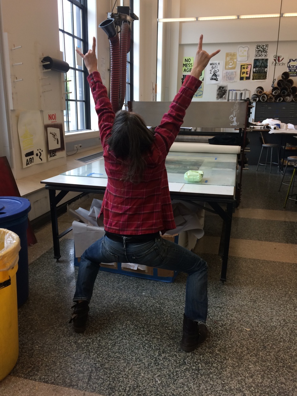 Lisa Anne Auerbach celebrating at the press with her arms in the air