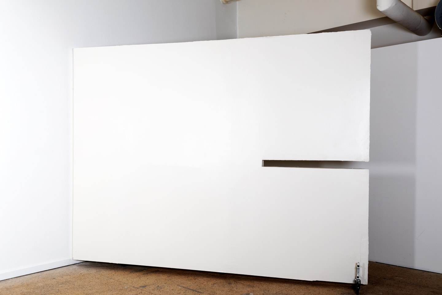 a wall with a long rectangle cut into it