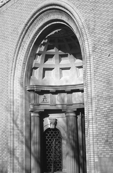 Black and white photo of an elaborately detailed niche in a classical building facade.