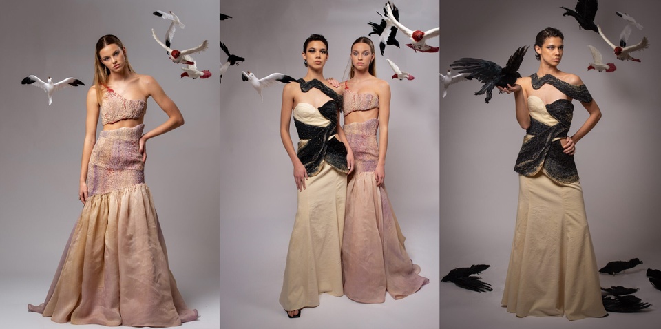 two models wearing long dresses surrounded by birds