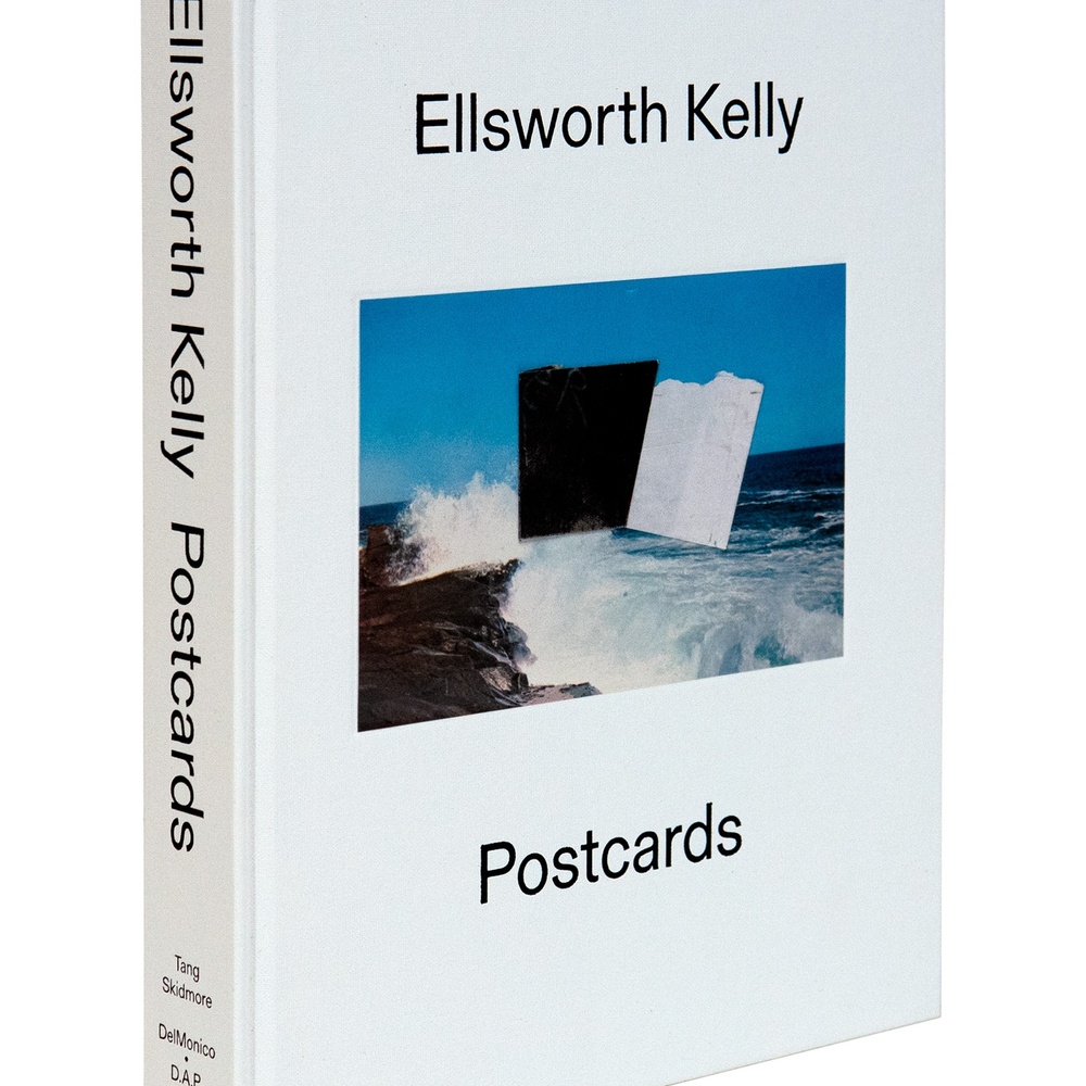 The front cover of Ellsworth Kelly: Postcards, featuring a postcard with roughly cut black and white squares of paper over a beach background.