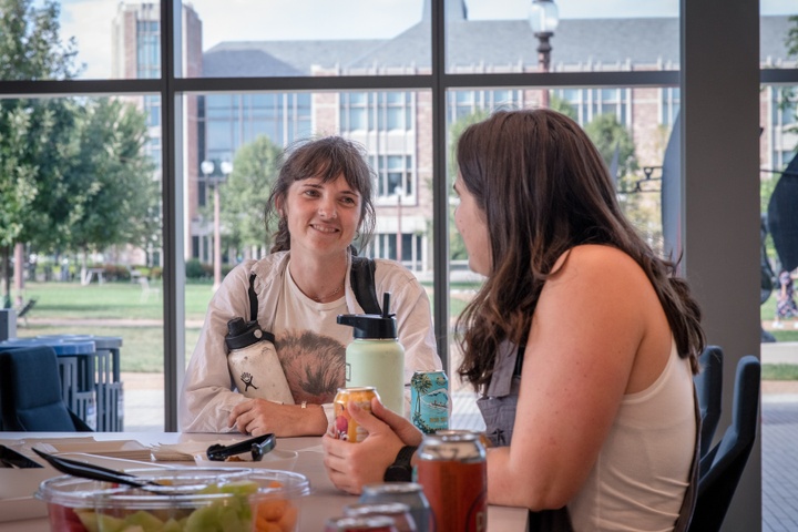 Two students talking at Weil Hall Commons