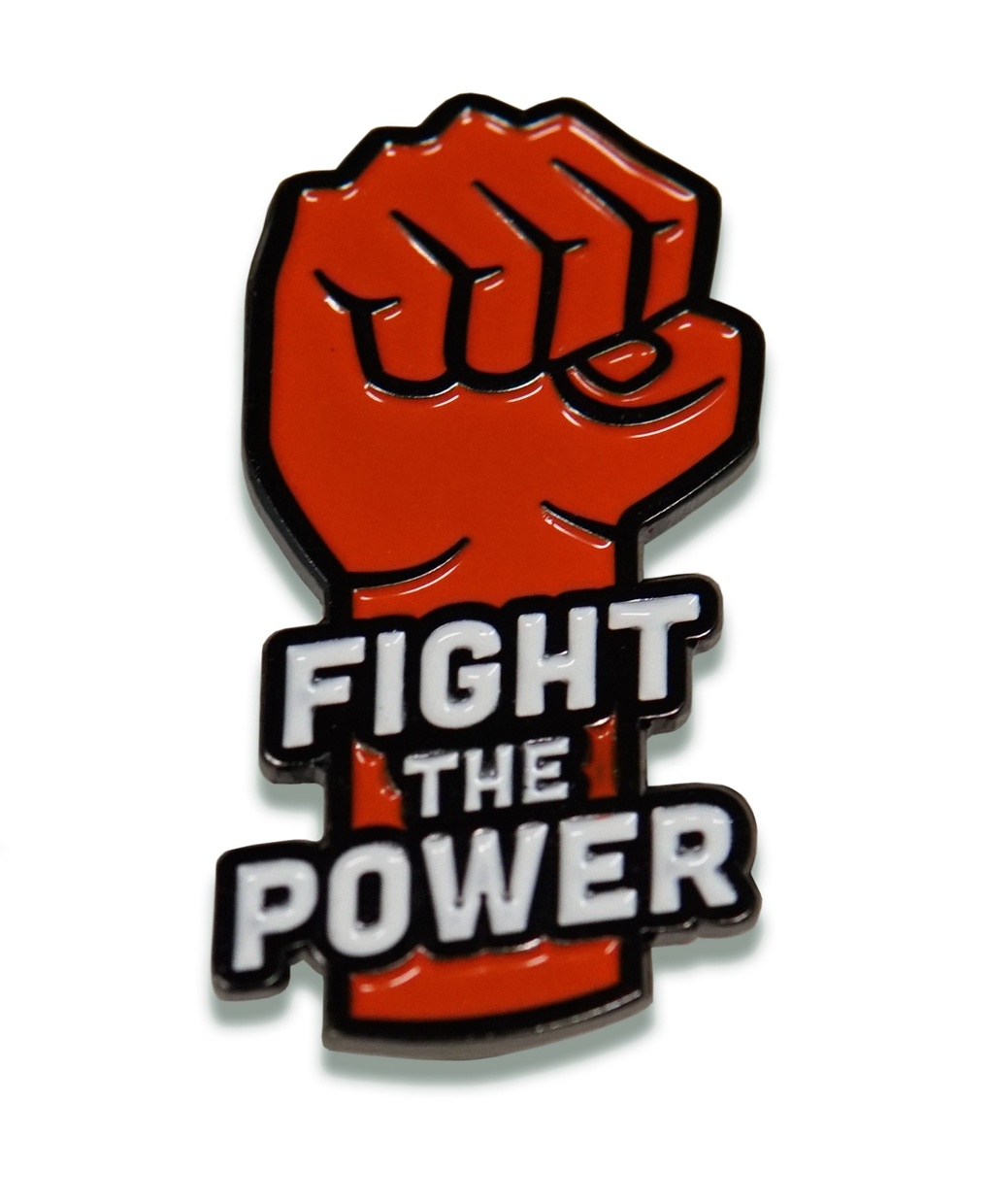 A small red pin shaped like a clenched fist with white text that reads “Fight the Power” overlapping the fist’s wrist.