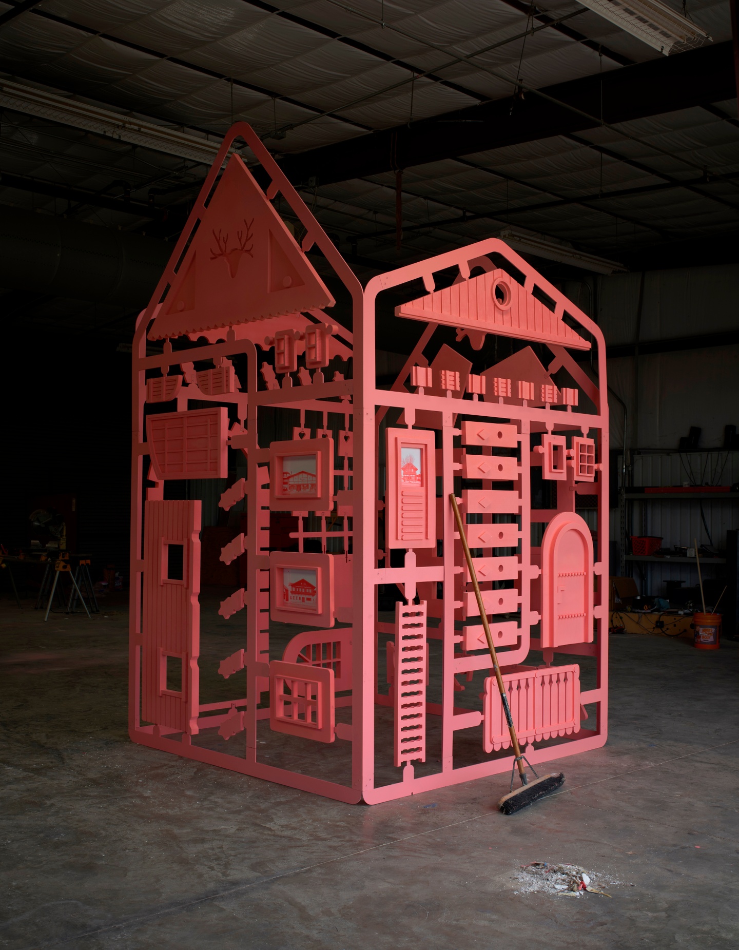 photo of red small building that looks like the pieces can be popped out like a game