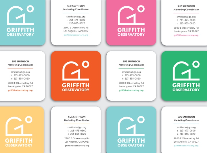 Business cards tiled front and back, fronts in variety of bright colors reads Griffith Observatory in white text with simple logo of building looking out to a circle. Back black text on white reads Sue Smithson, Marketing Coordinator, with email, phone numbers, address, and URL.
