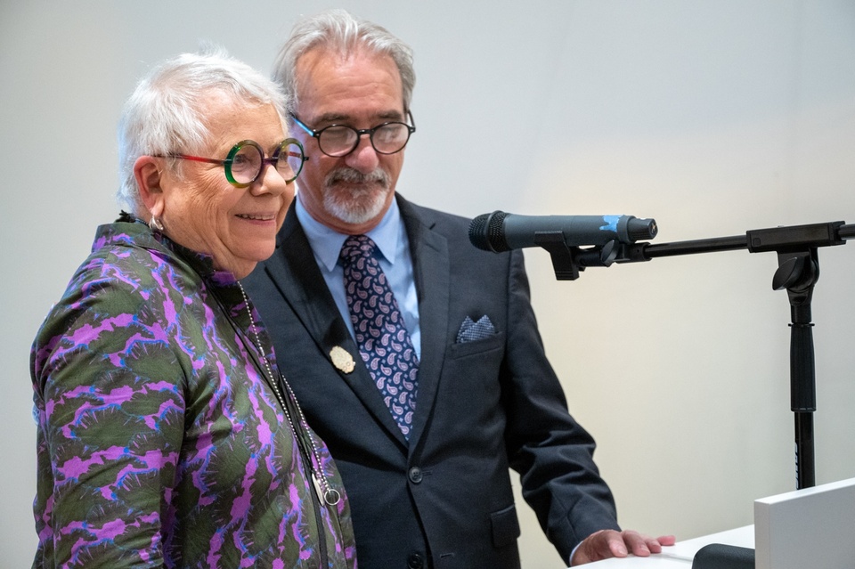 Georgia Binnington and Dean Carmon Colangelo at the lecturn.