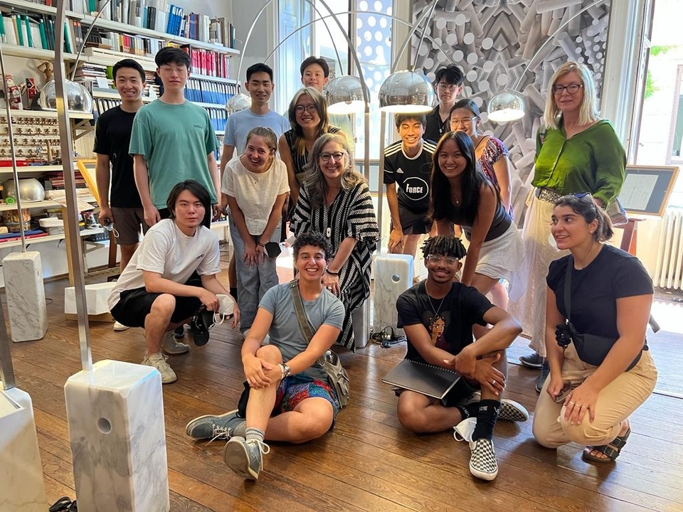 group of students posing for photo in an architecture studio office