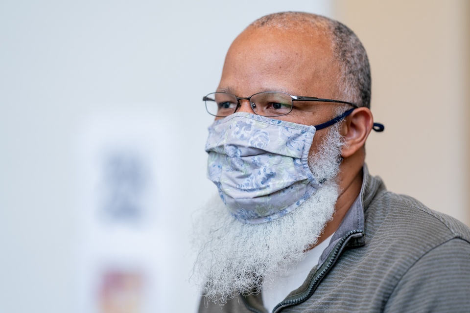 Close up of artist Meleko Mokgosi wearing face mask