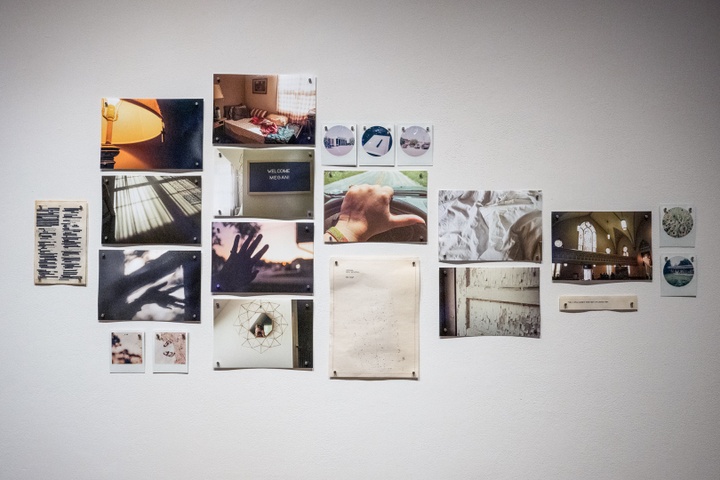 Megan Kenyon's prints and photographs on a wall