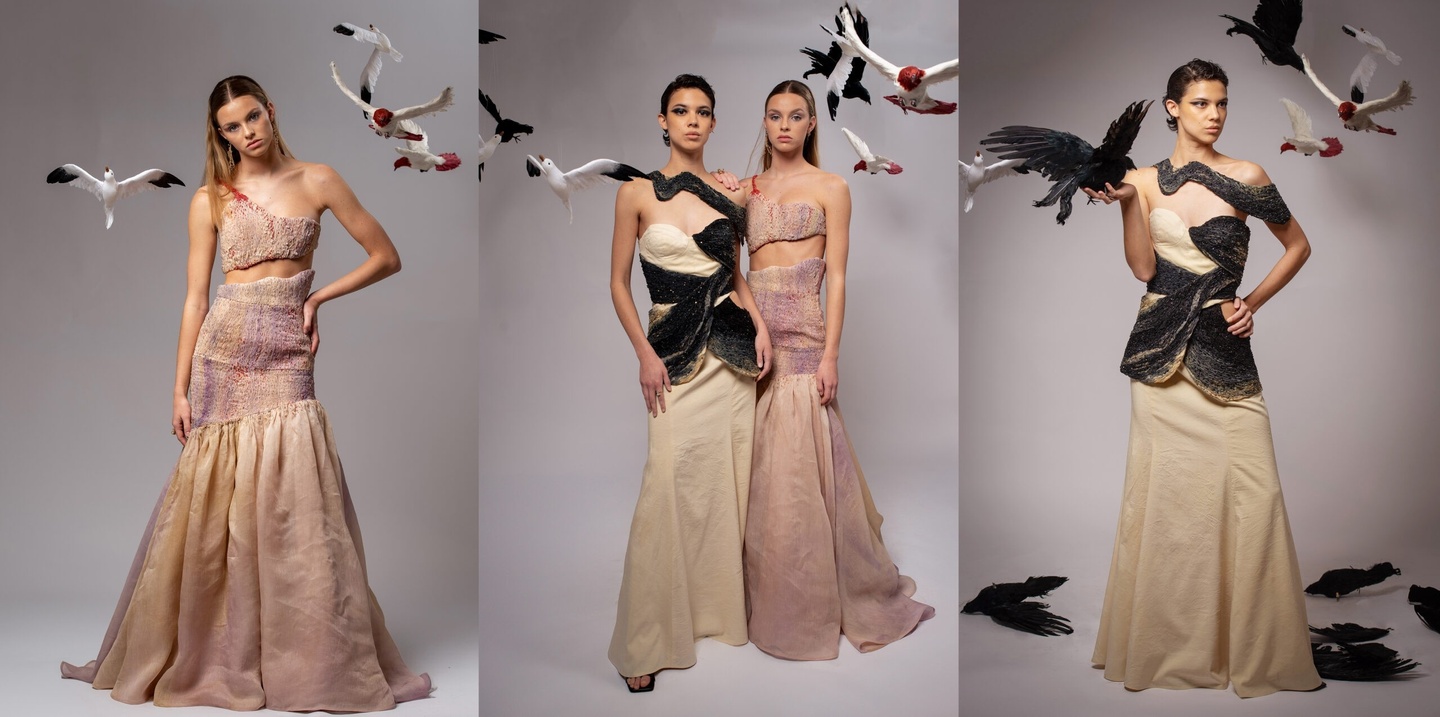 two models wearing long dresses surrounded by birds