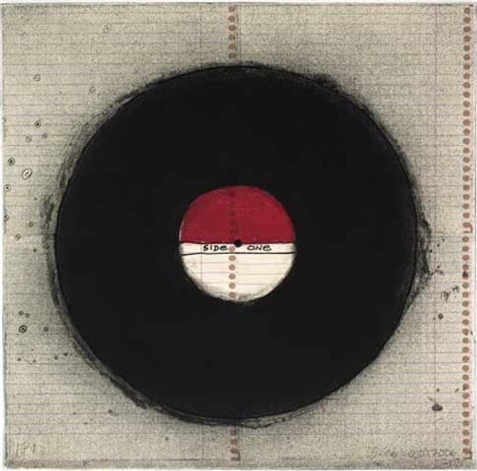 Image of a black record with a red and white label on a gray background 