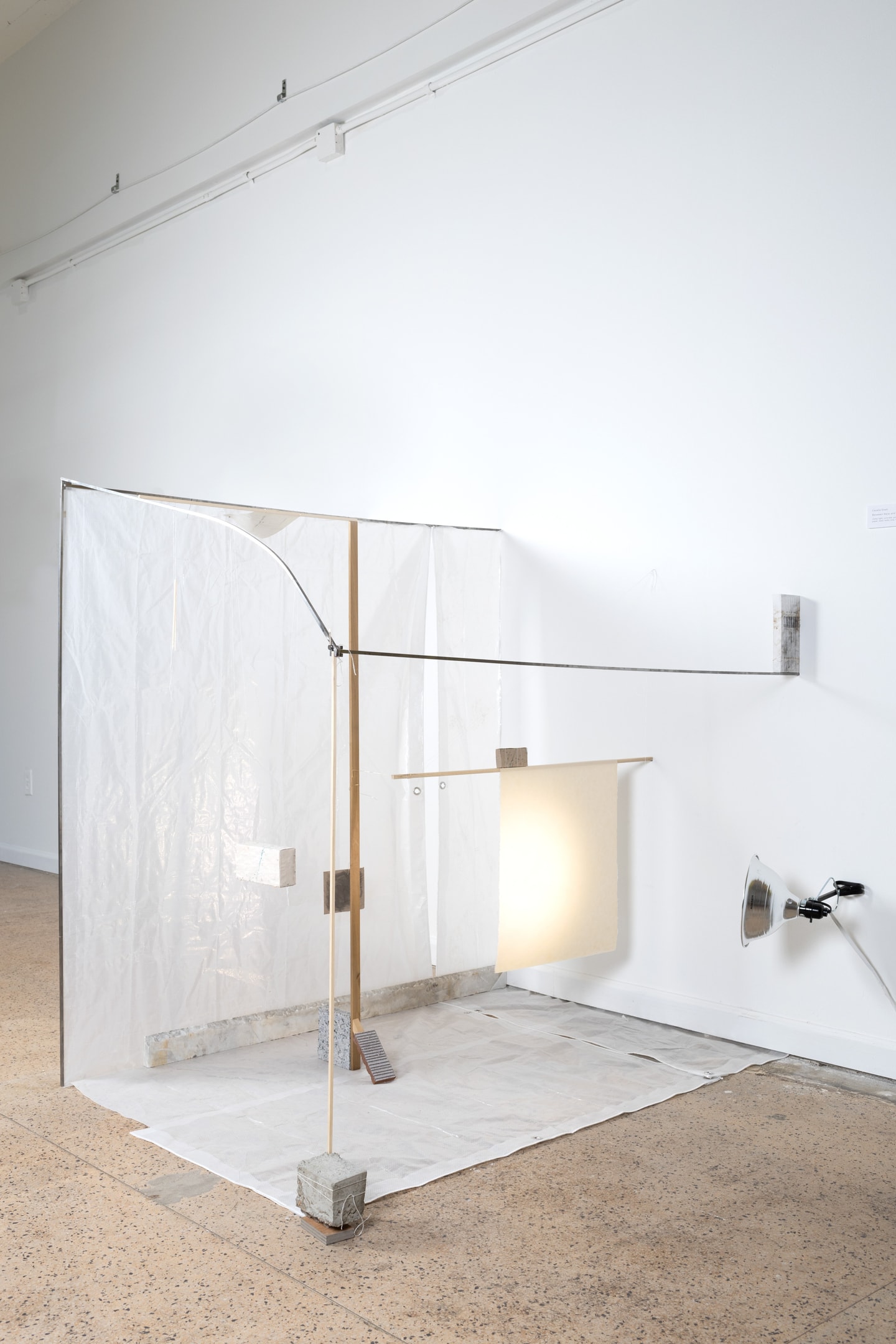 installation view wall of fabric and light