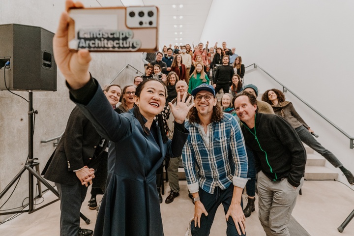 Voraakhom takes a selfie with a crowd at the Pulizter Arts Foundation.