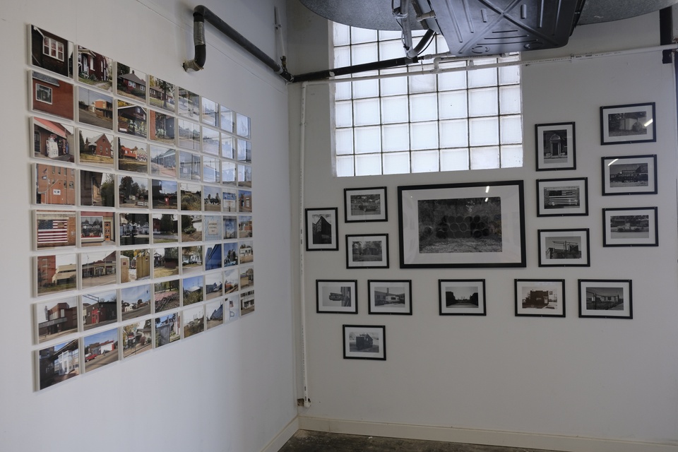 Photo of a gallery installation of photographs. 
