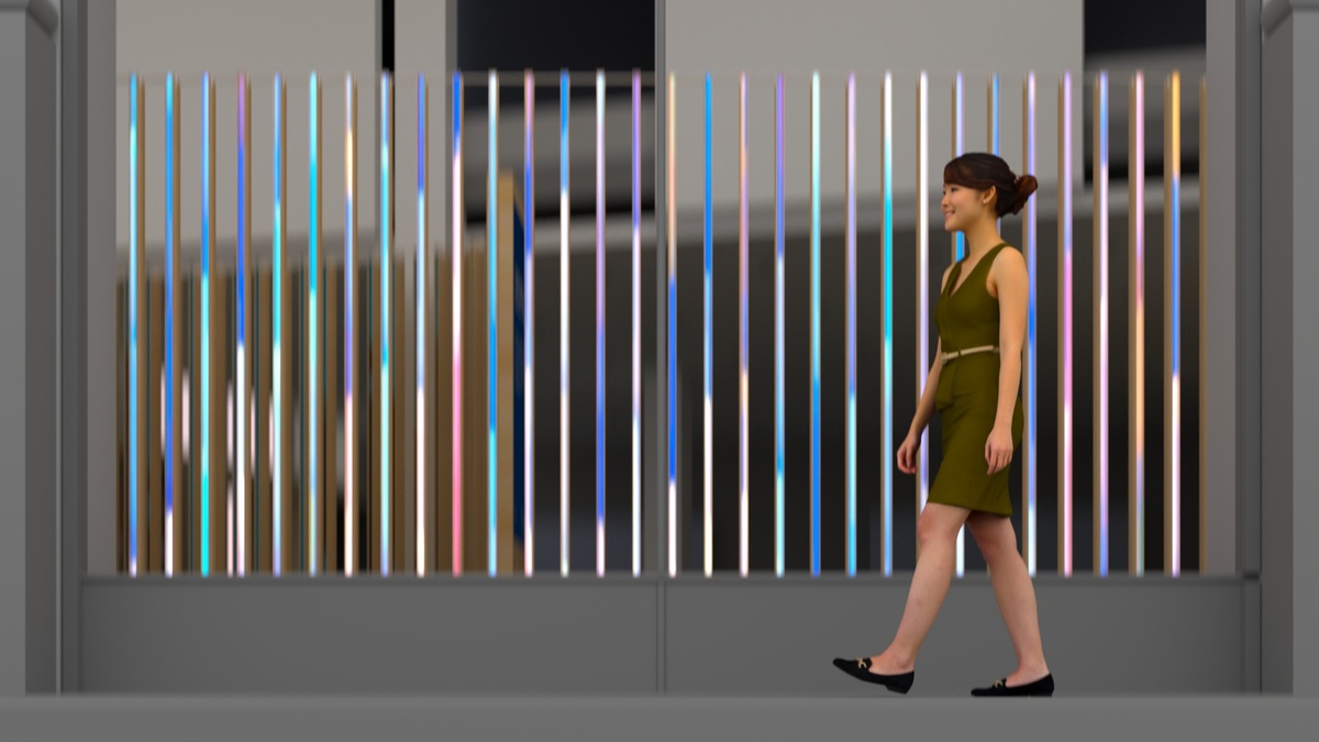 Render of woman walking past Okta installation that responds to her motion with colorful animation