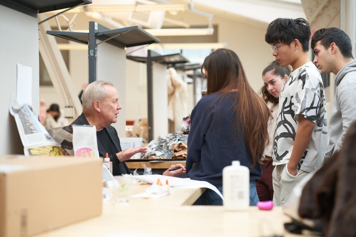 Wilson converses with a group of students in the architecture studios.