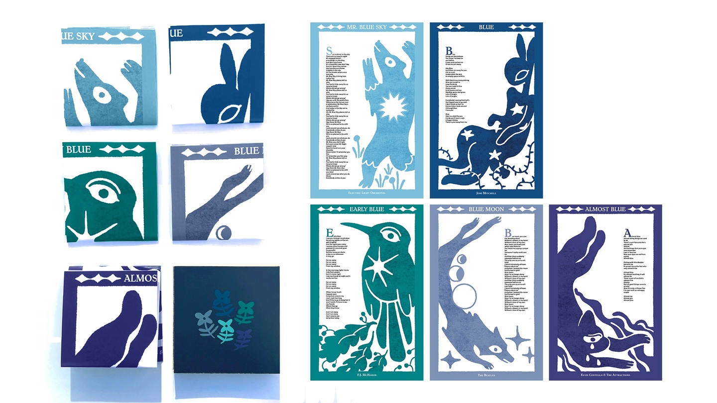 Varying blue lyric sheets with illustrated borders and animals on them. 