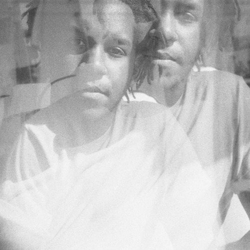 A double exposed black-and-white portrait of S*an D. Henry-Smith