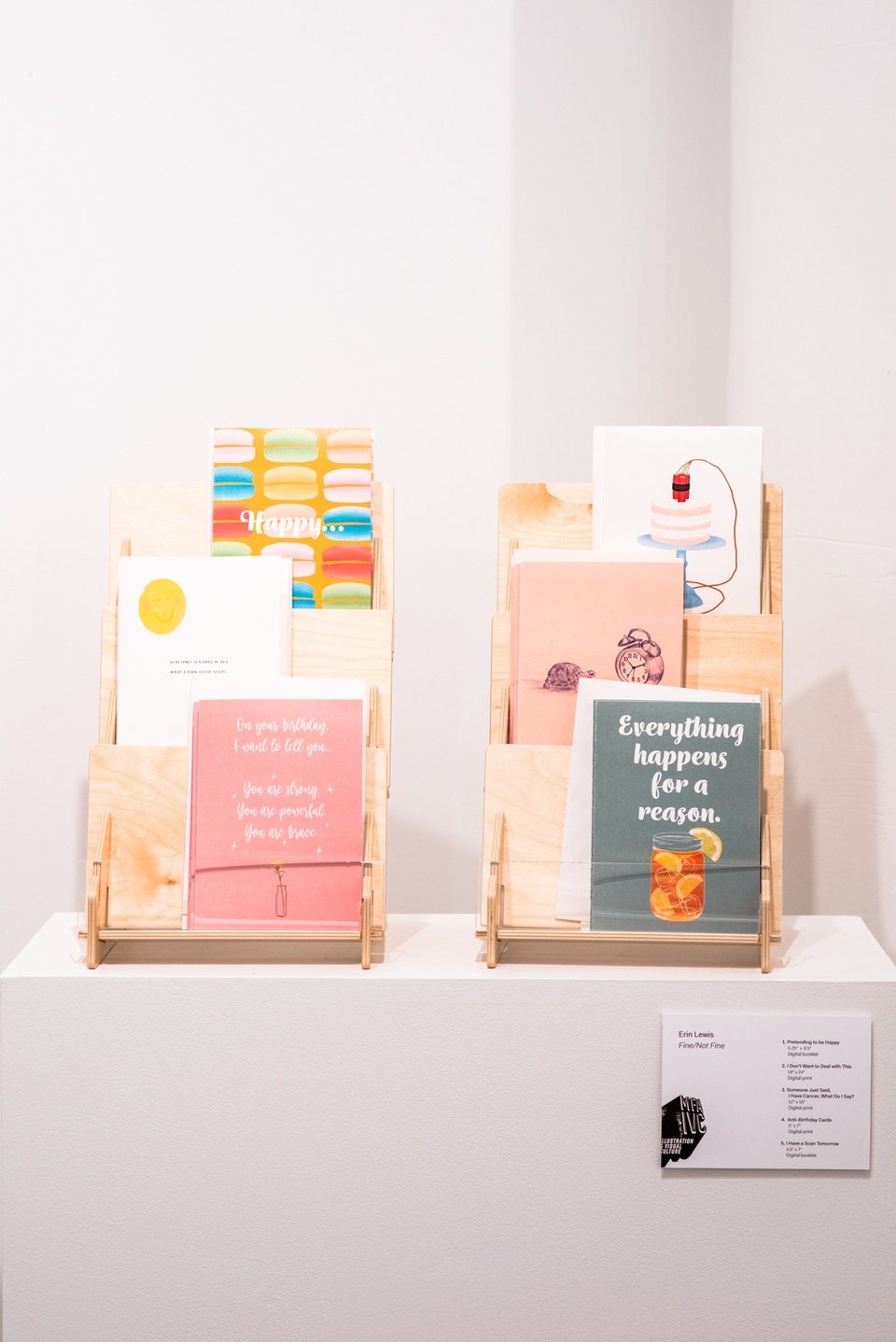 Two brochure racks with six sympathy greeting card designs.