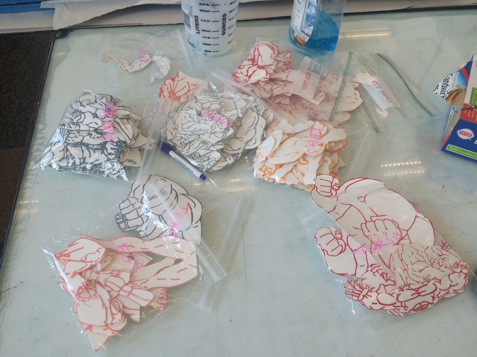 Plastic baggies with collage elements on table