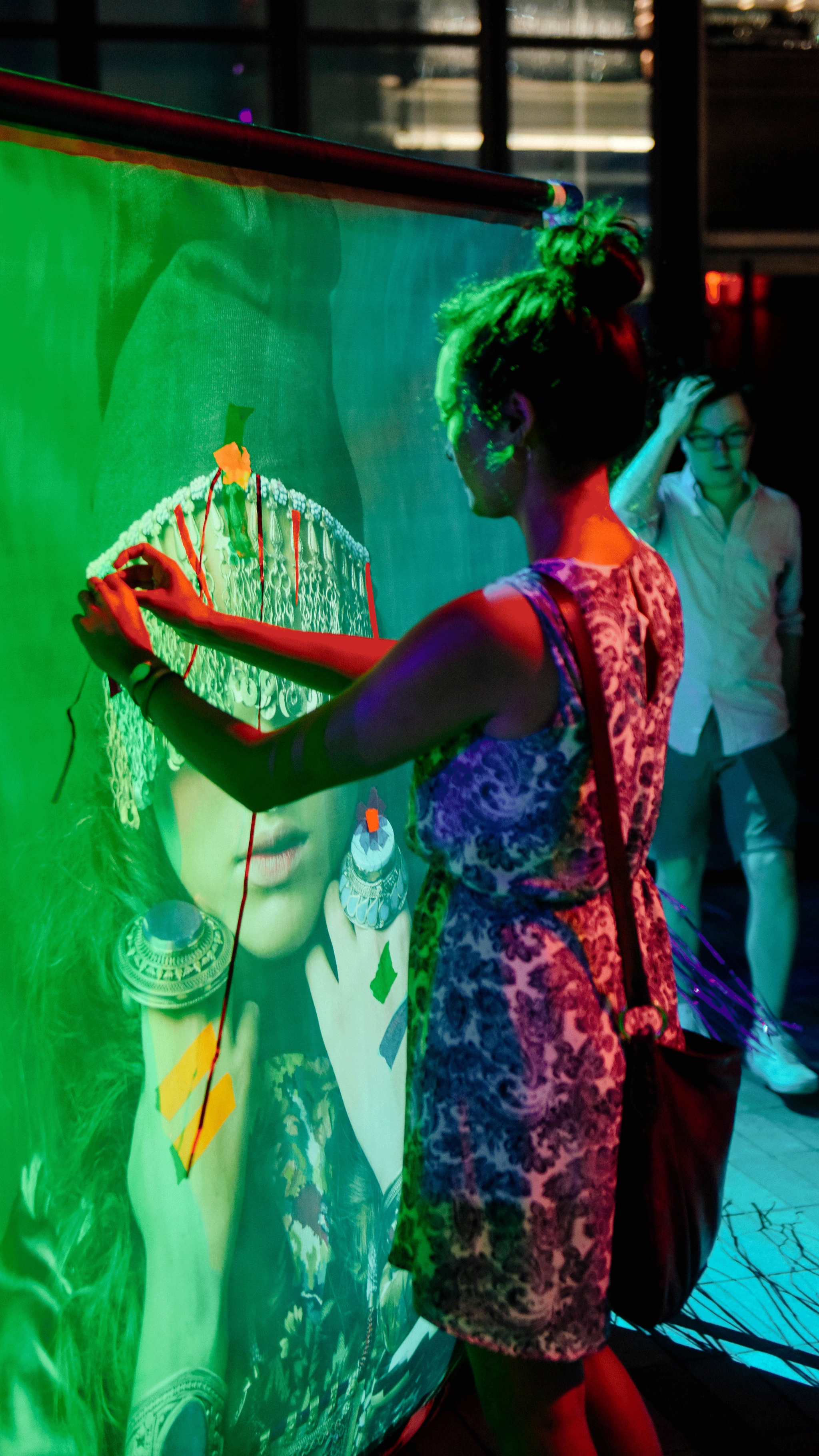 An audience member interacting with an installation artwork by MIPSTERZ.