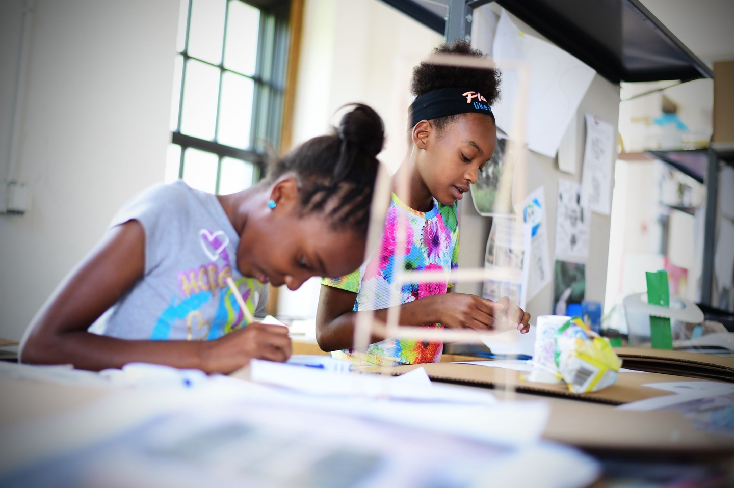 Two young students working on architecture project