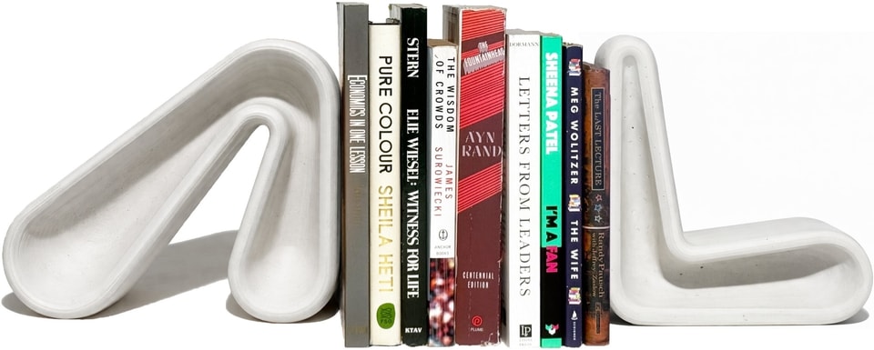 White bookends holding a stack of books