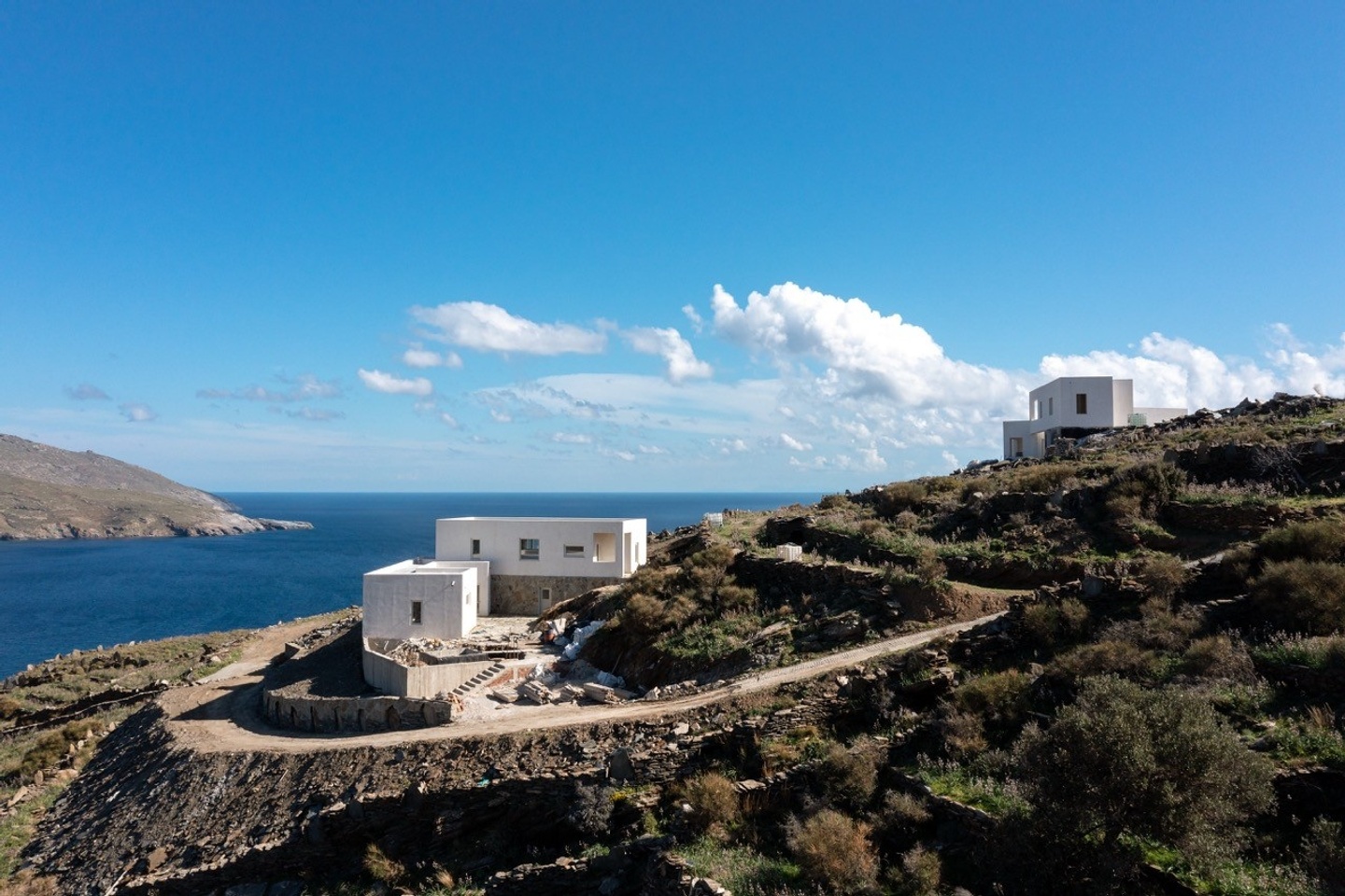 Korthi Houses, a group of interconnected structures overlooking Korthi Bay on the Greek island of Andros