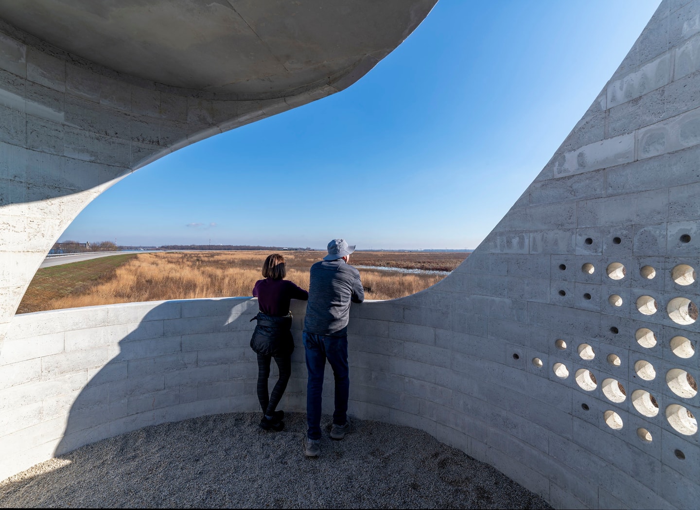 two people standing in the bird blind
