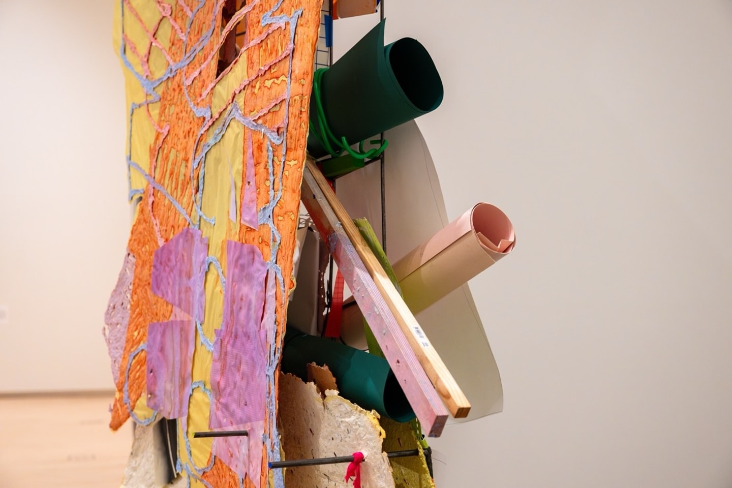 detail of sculptural collage of mixed media such as papers and wires in many colors 