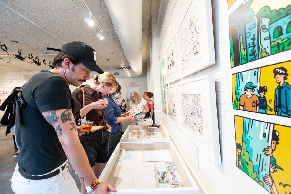 Visitors look at the display sketches