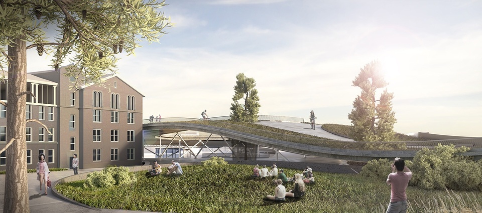 Rendering of the university entrance, with a sloping pedestrian bridge that's partially paved, partially landscaped. People are seated on the grass in front of a university building.