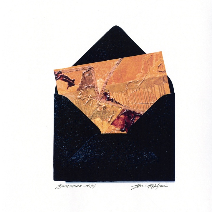 An open black envelope revealing a textured piece of pinkish-beige paper sticking out, with dark red and goldish embellishments and markings.